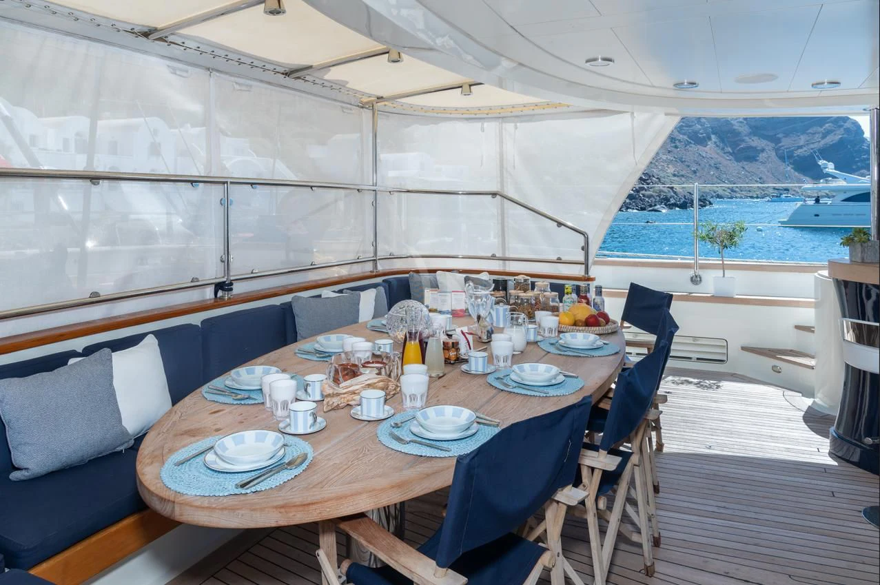 a table set for a meal aboard VICTORIA A Yacht for Charter
