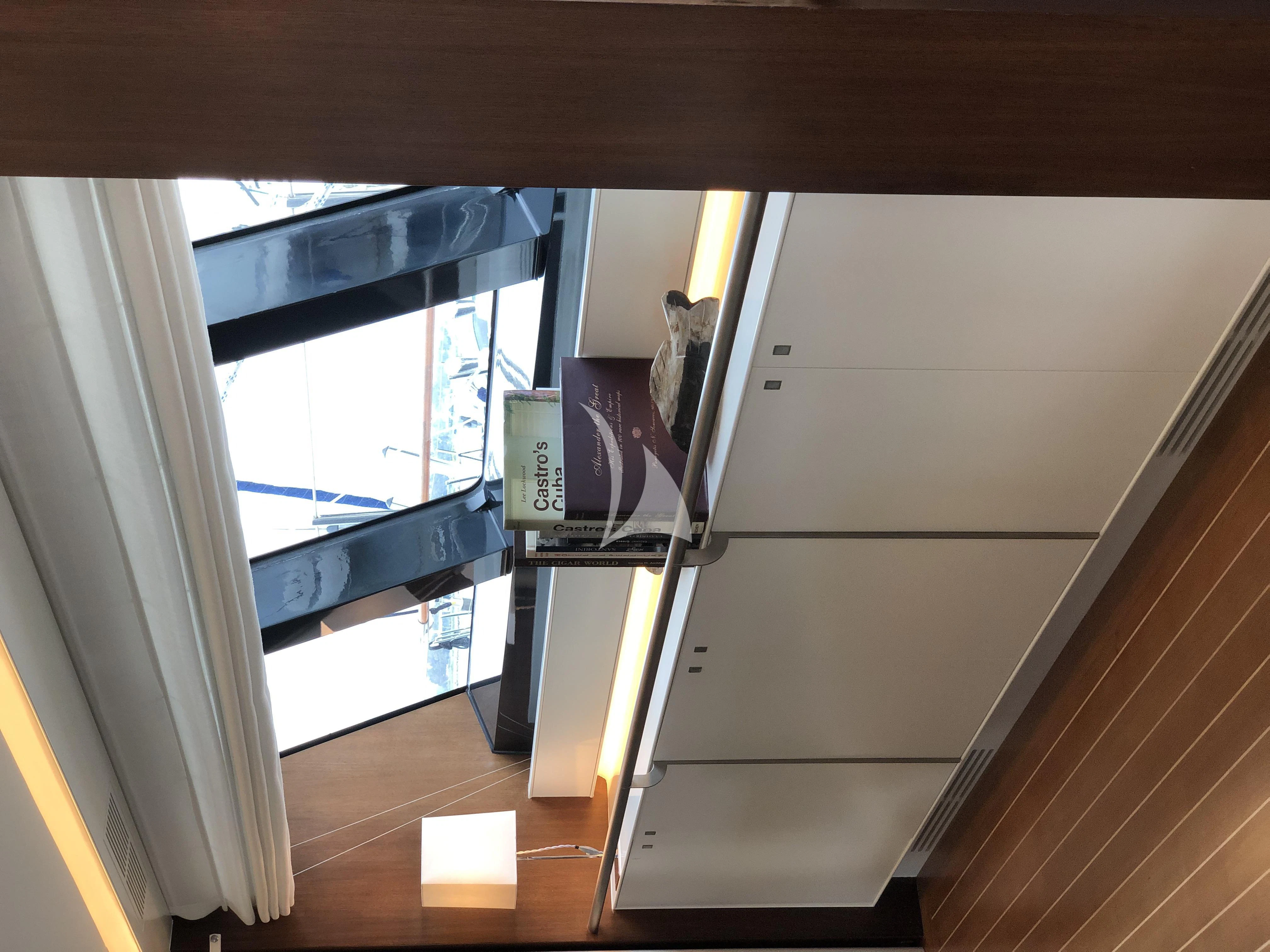 a room with a window and a door with a window aboard VICTORIA A Yacht for Charter