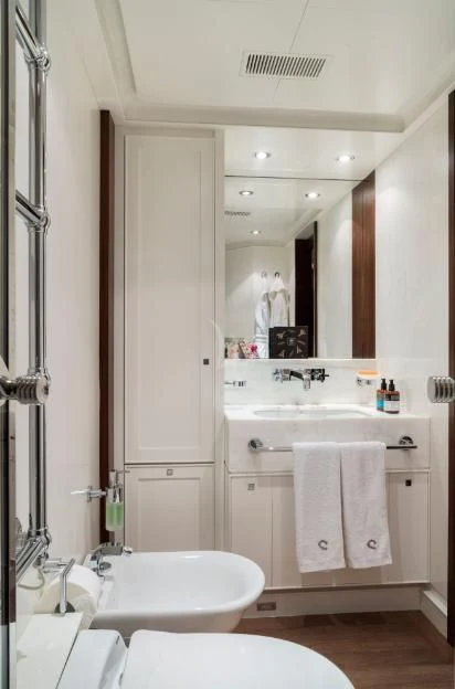 a bathroom with a large mirror aboard VICTORIA A Yacht for Charter