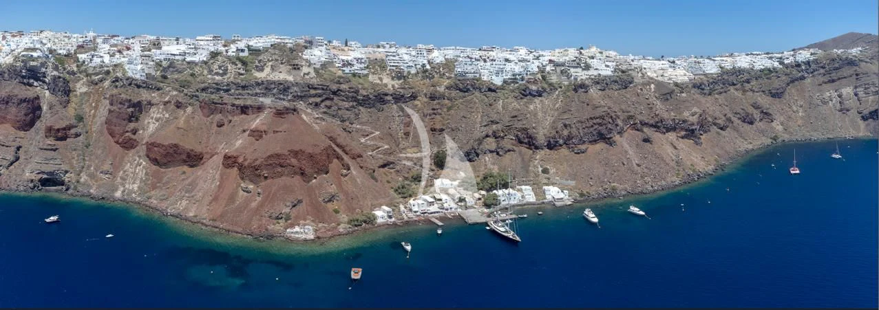 a body of water with boats in it and a town on the other side of it aboard VICTORIA A Yacht for Charter