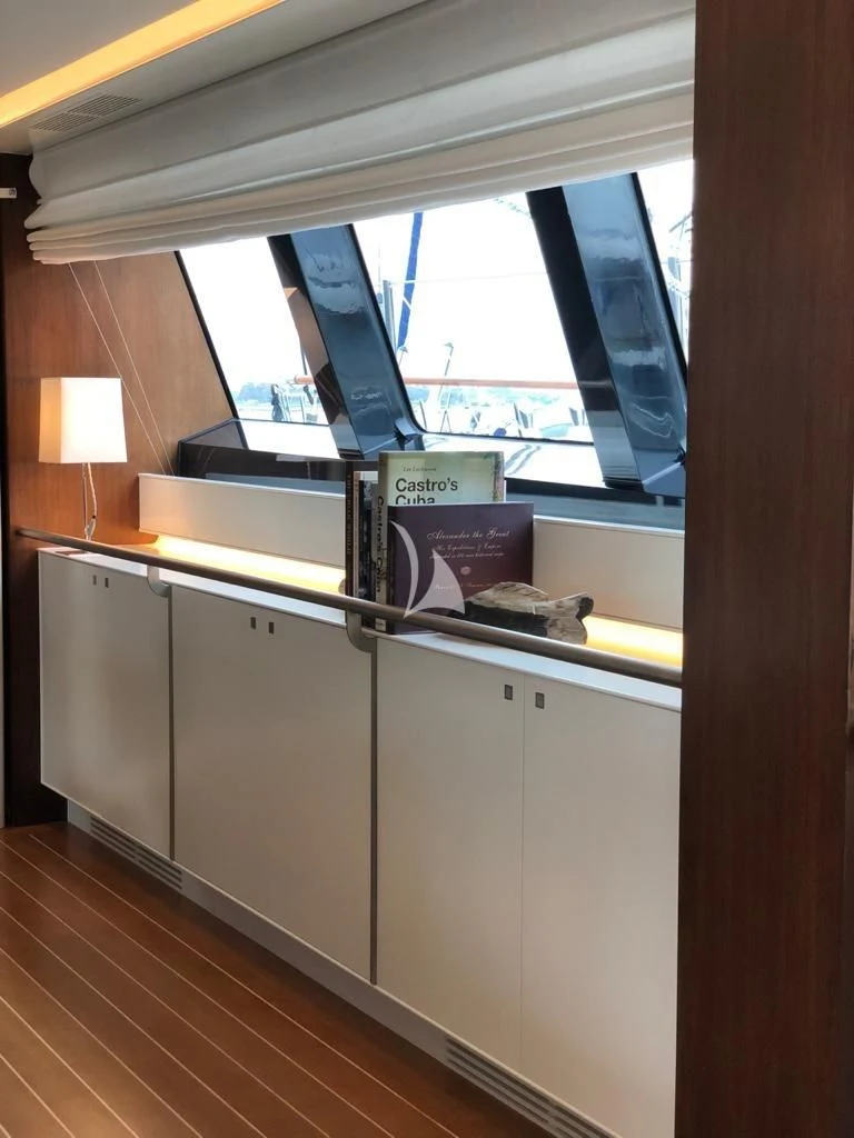 a room with a desk and a window aboard VICTORIA A Yacht for Charter