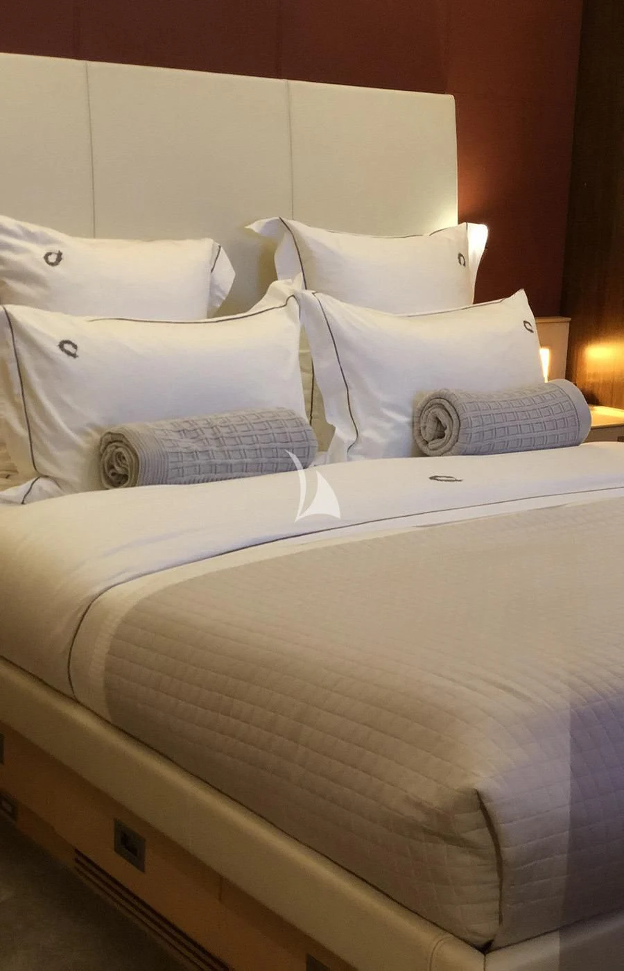a bed with pillows aboard VICTORIA A Yacht for Charter