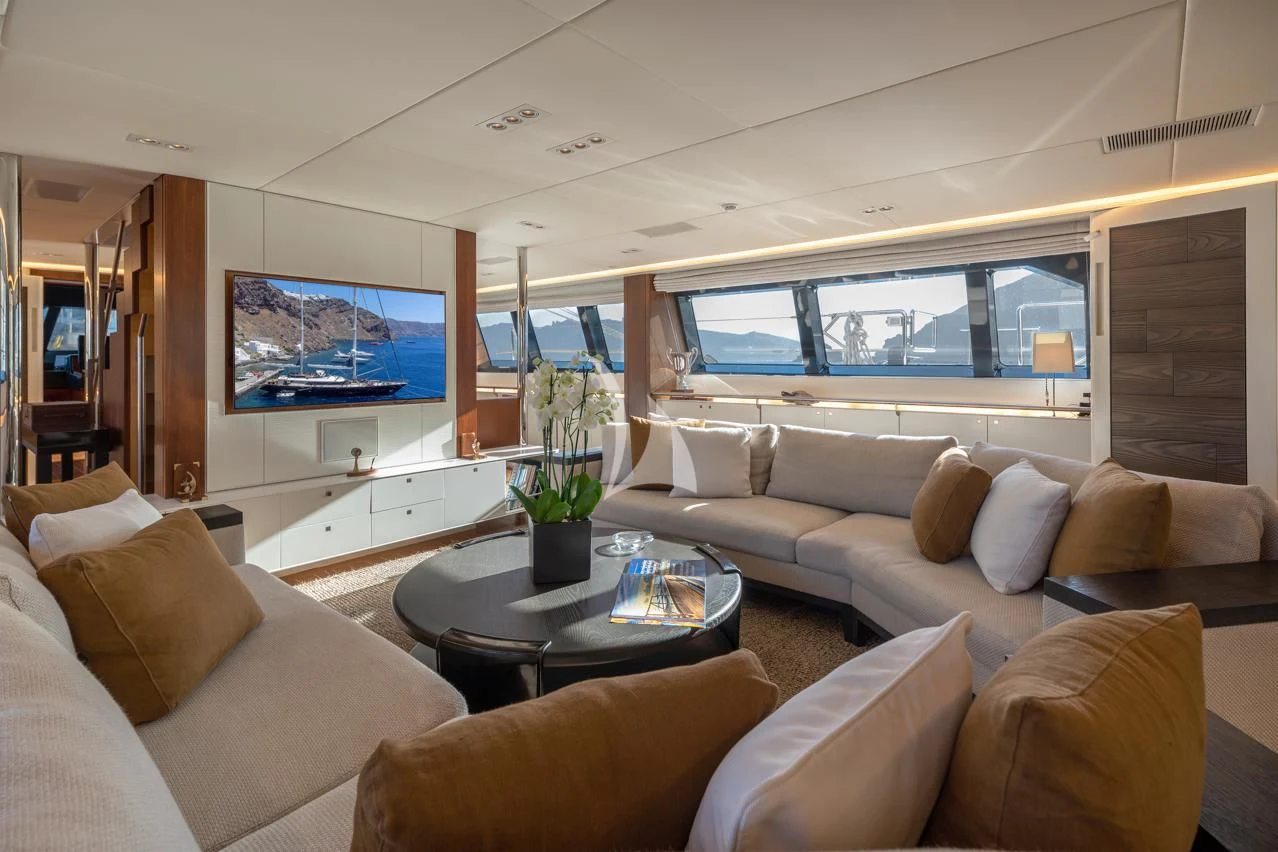 a living room with a large window aboard VICTORIA A Yacht for Charter