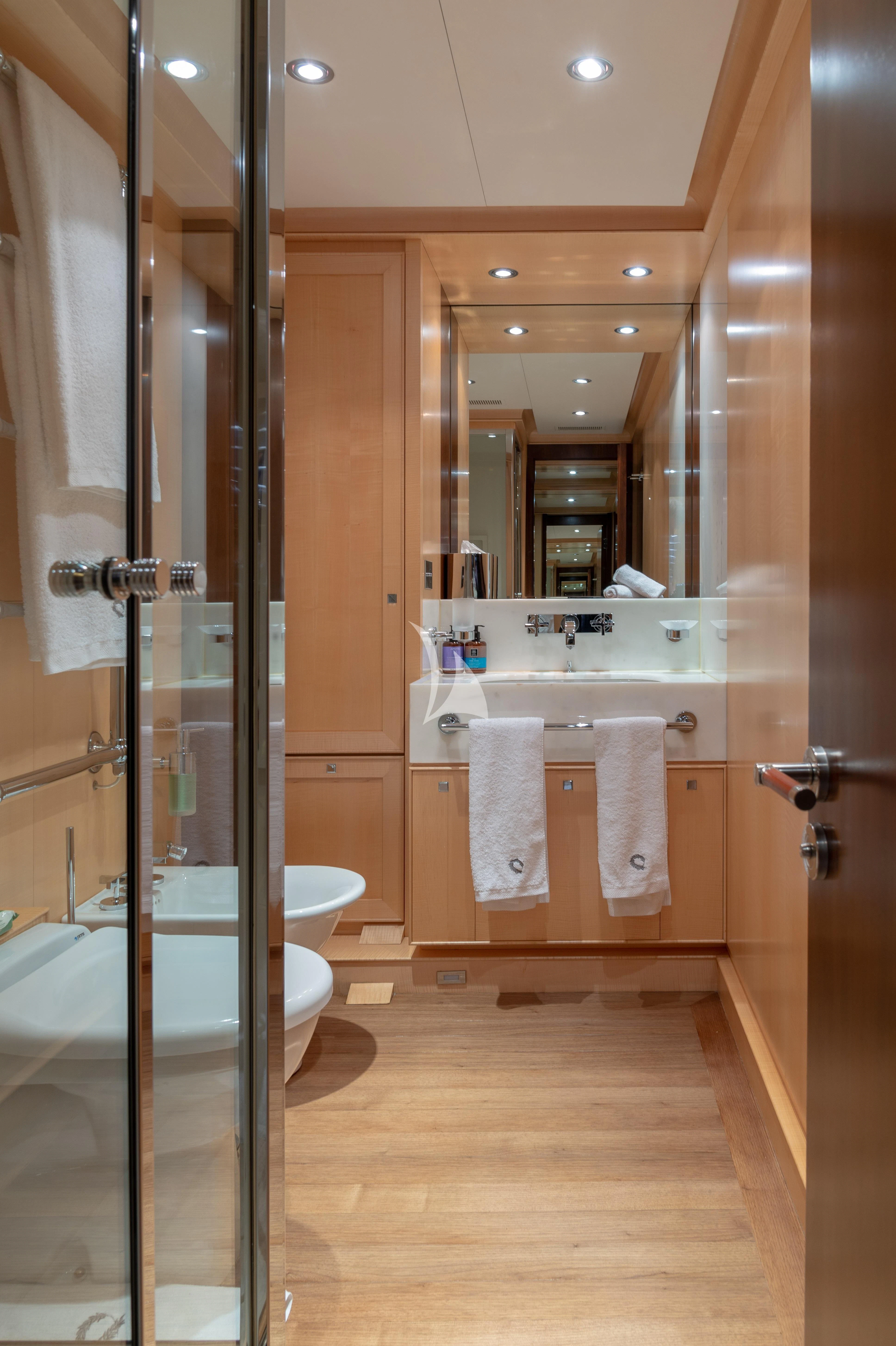 a bathroom with a large mirror aboard VICTORIA A Yacht for Charter