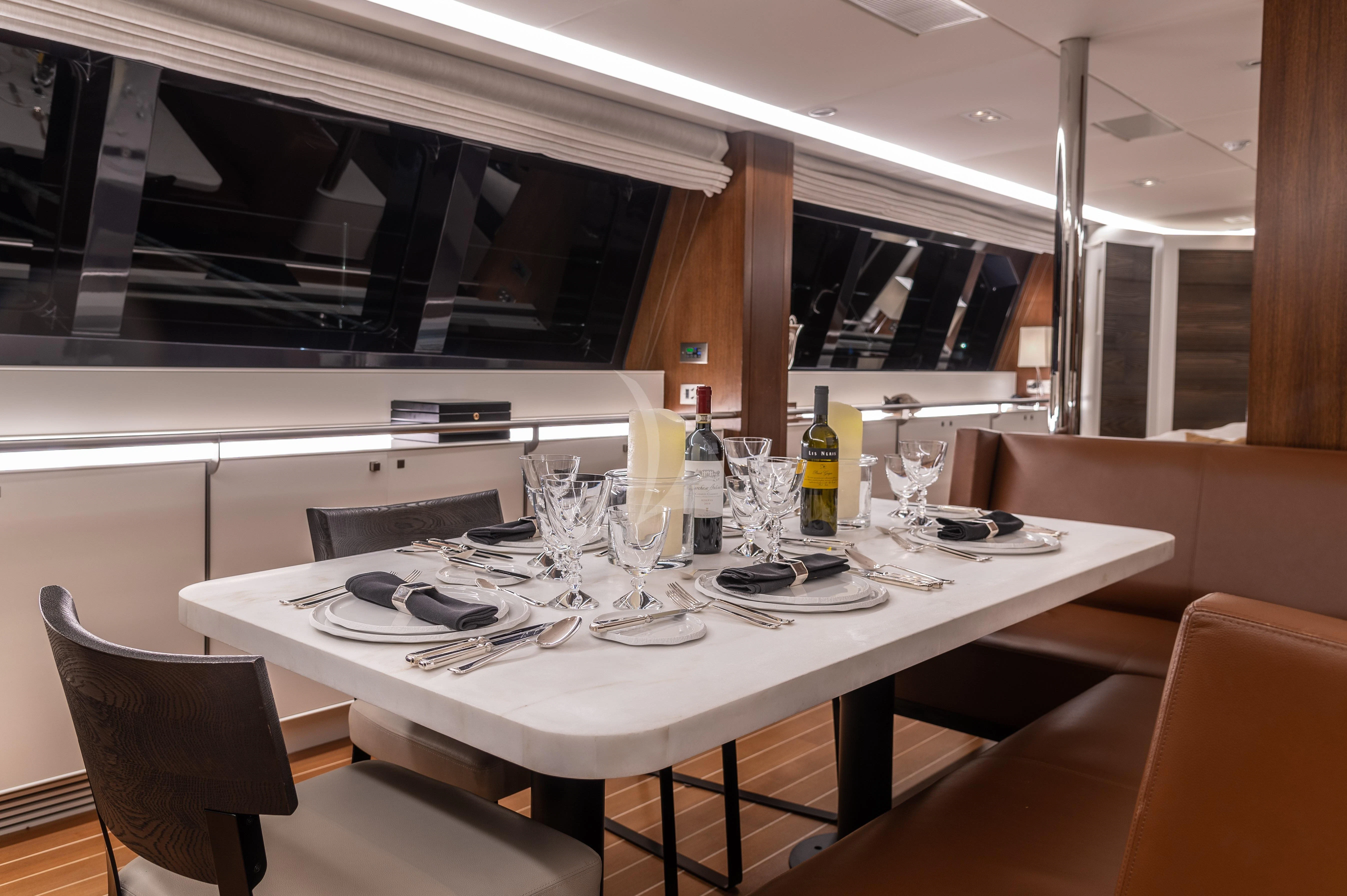 a table set for a dinner aboard VICTORIA A Yacht for Charter
