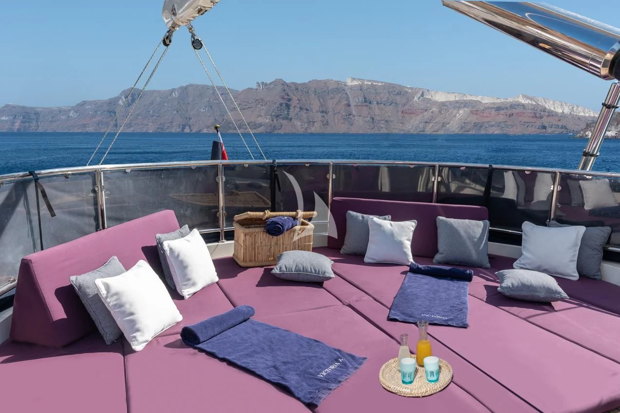 a bed with pillows and pillows aboard VICTORIA A Yacht for Charter