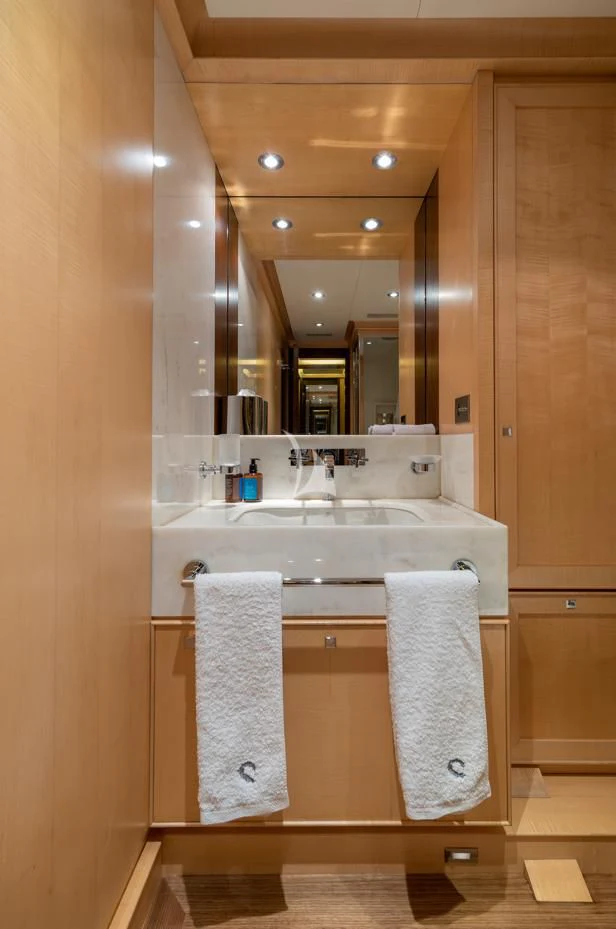 a bathroom with a large mirror aboard VICTORIA A Yacht for Charter