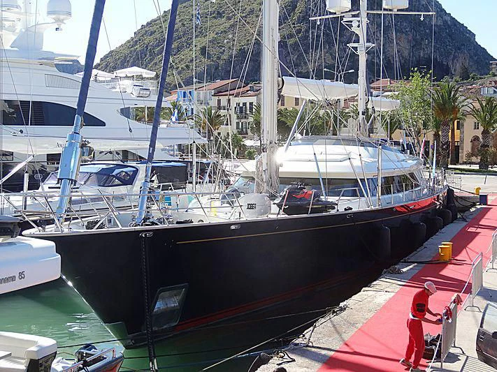 a boat docked at a pier aboard VICTORIA A Yacht for Charter