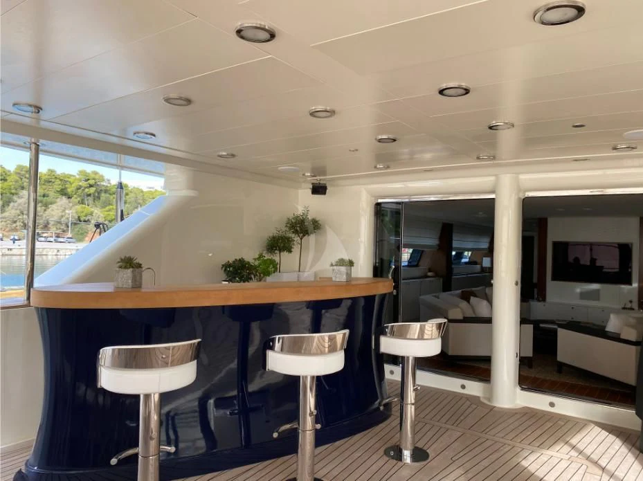 a room with stools and tables aboard VICTORIA A Yacht for Charter