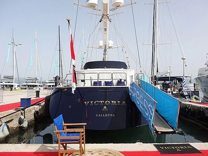 a boat parked on the dock aboard VICTORIA A Yacht for Charter