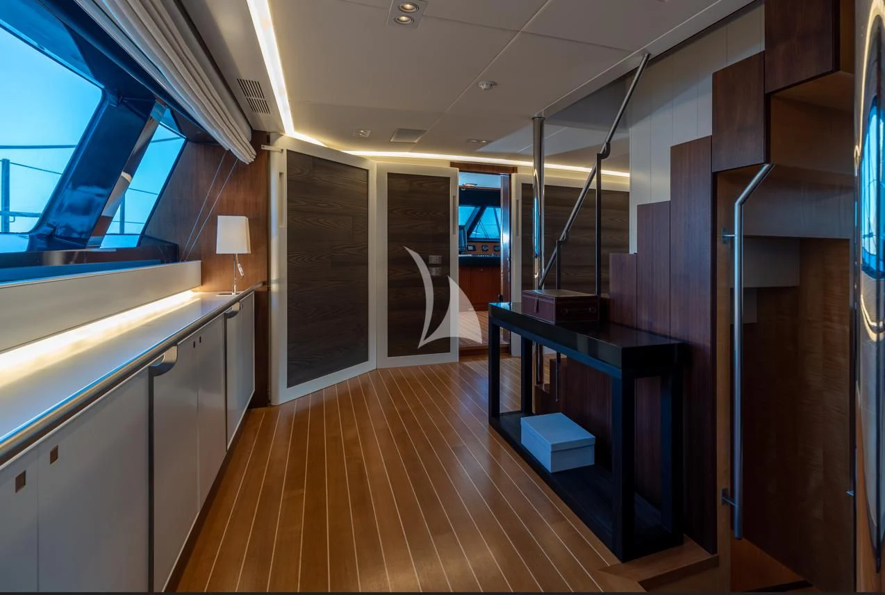a room with a wood floor and cabinets and a wood floor aboard VICTORIA A Yacht for Charter