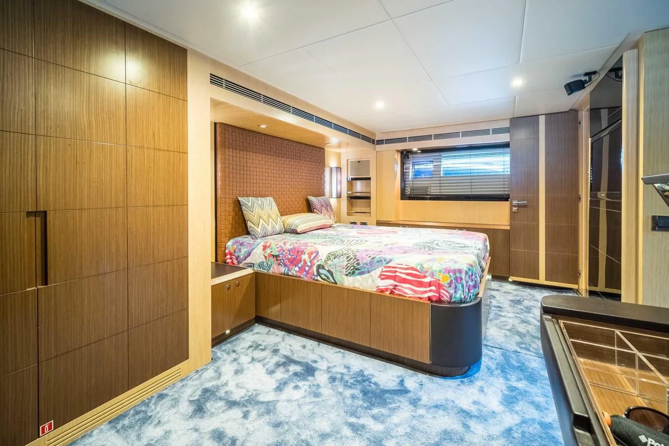 a bedroom with a bed aboard CHARISMA II Yacht for Sale