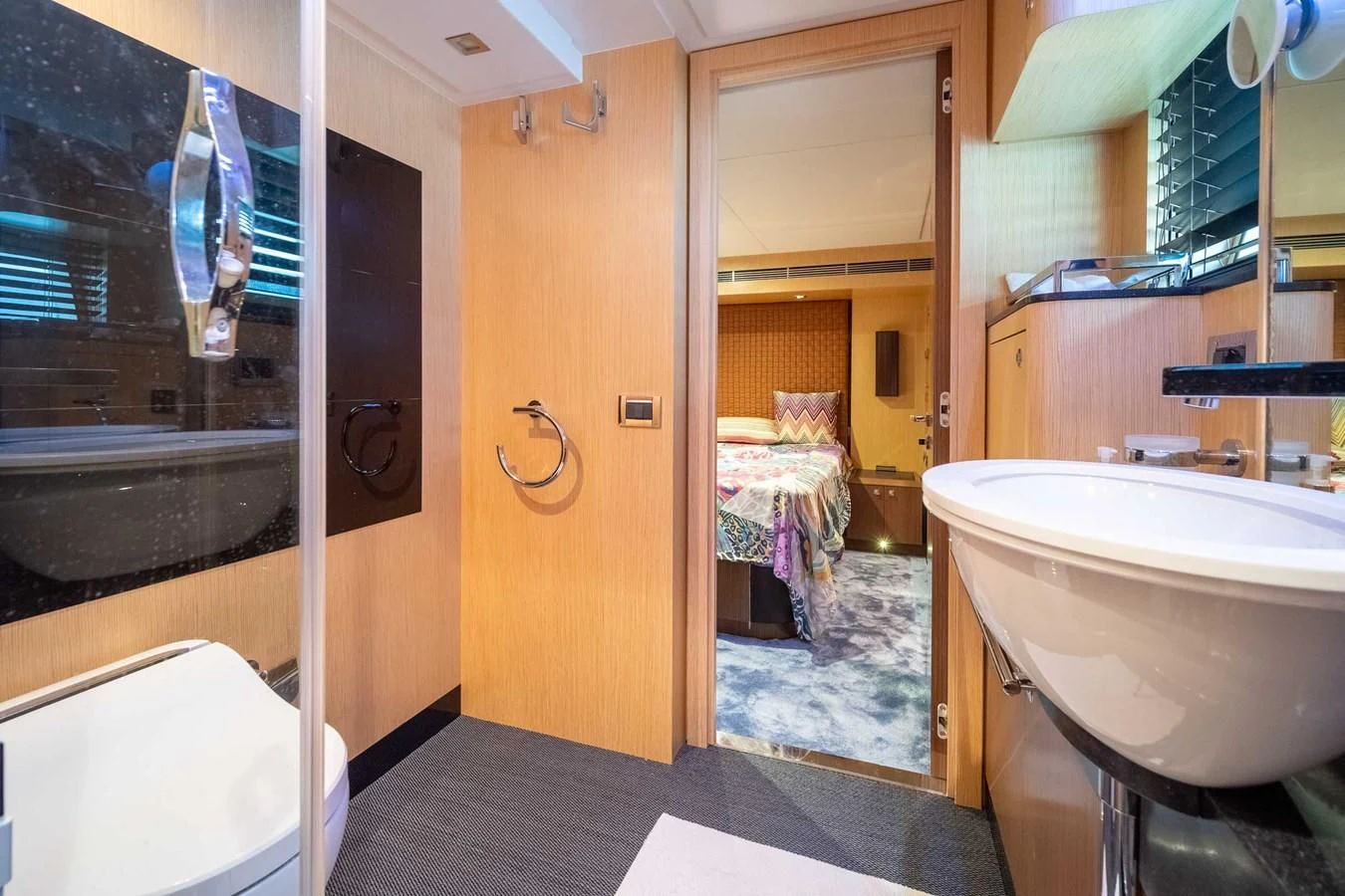 a bathroom with a tub sink and toilet aboard CHARISMA II Yacht for Sale