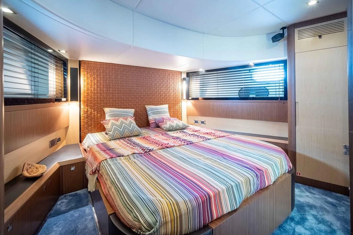a bedroom with a bed and a window aboard CHARISMA II Yacht for Sale