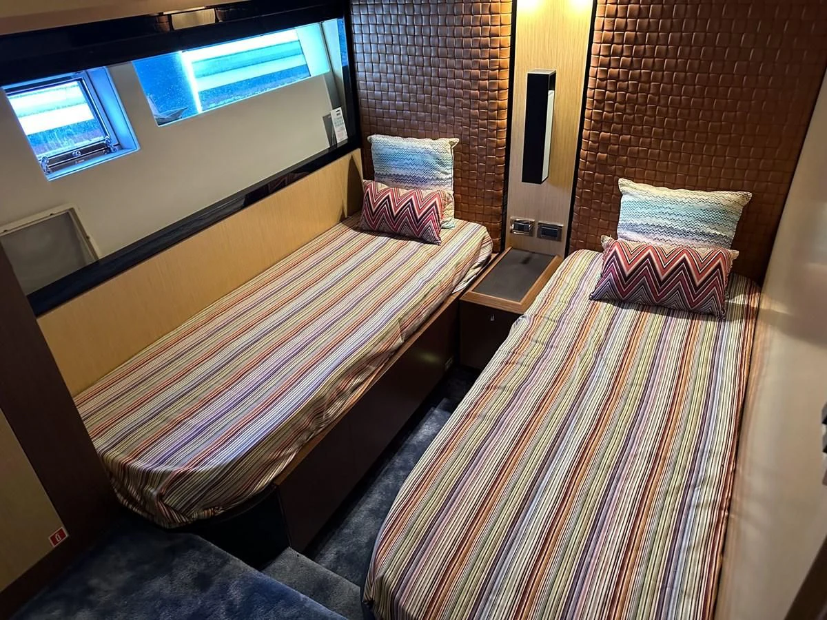 a couple of beds in a room aboard CHARISMA II Yacht for Sale