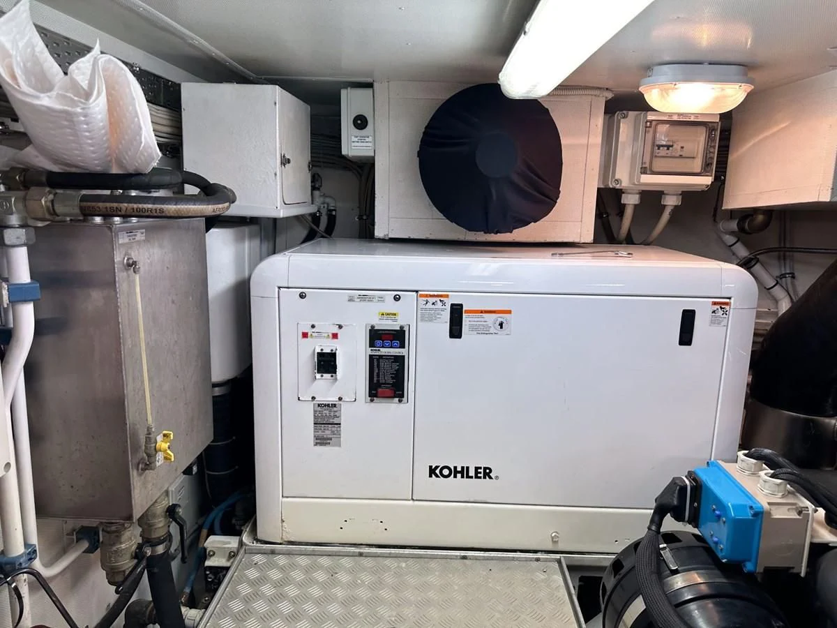 a large machine in a room aboard CHARISMA II Yacht for Sale