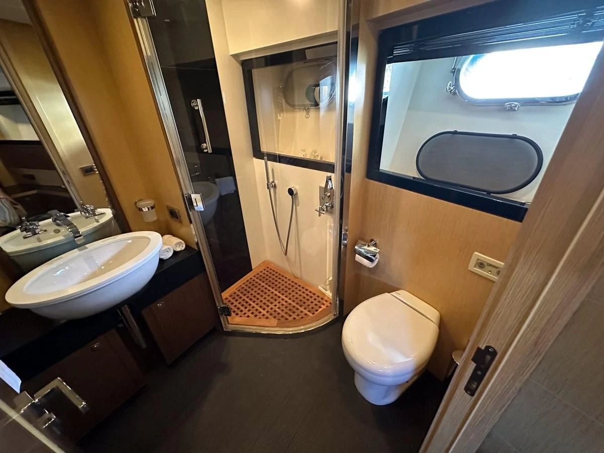 a bathroom with a glass shower aboard CHARISMA II Yacht for Sale