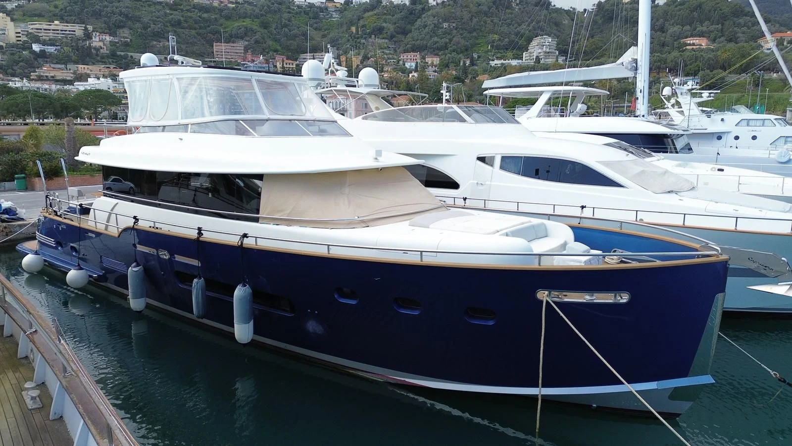 a boat docked at a pier aboard CHARISMA II Yacht for Sale