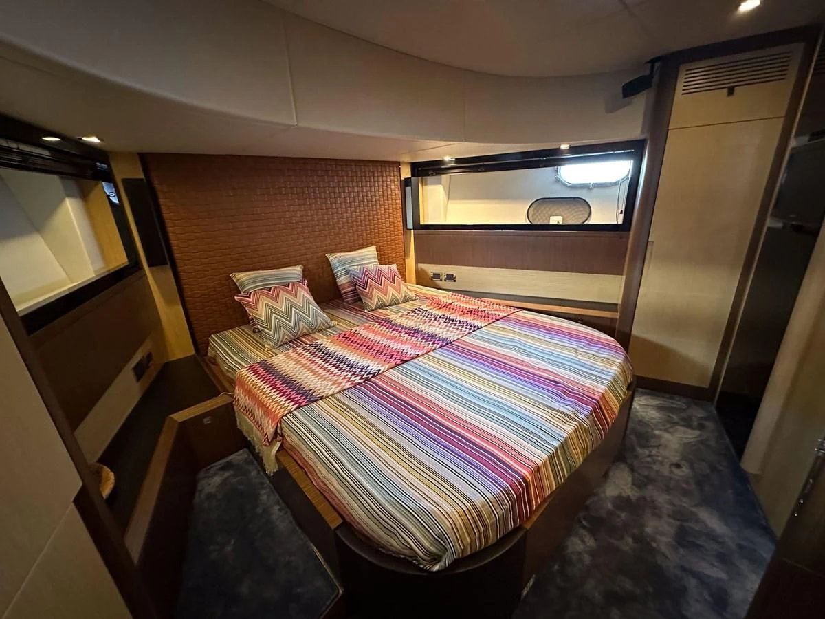 a bed in a room aboard CHARISMA II Yacht for Sale