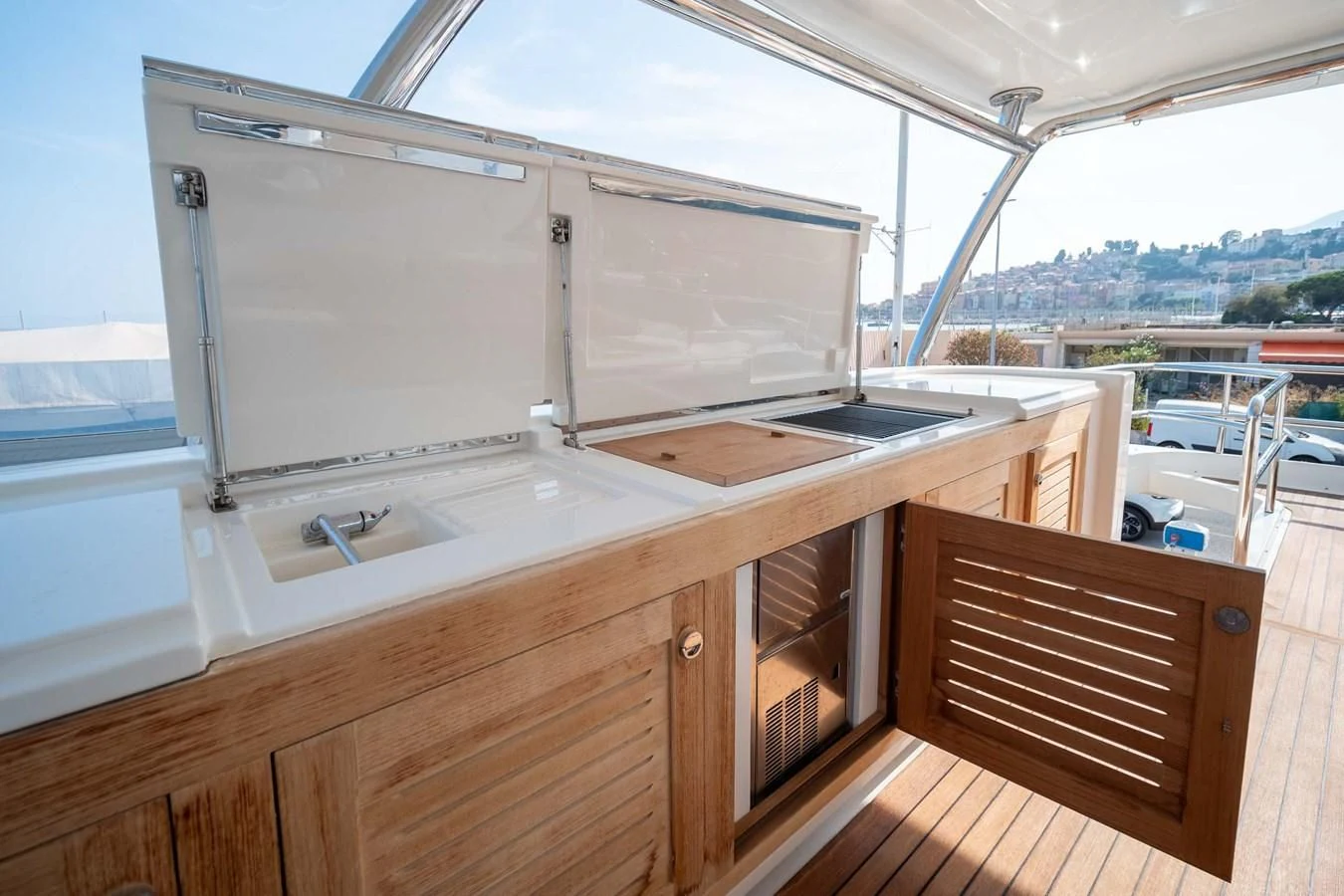 a kitchen with a large white refrigerator aboard CHARISMA II Yacht for Sale