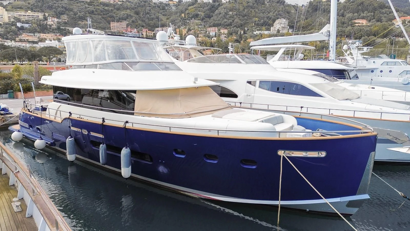 a boat docked at a pier aboard CHARISMA II Yacht for Sale