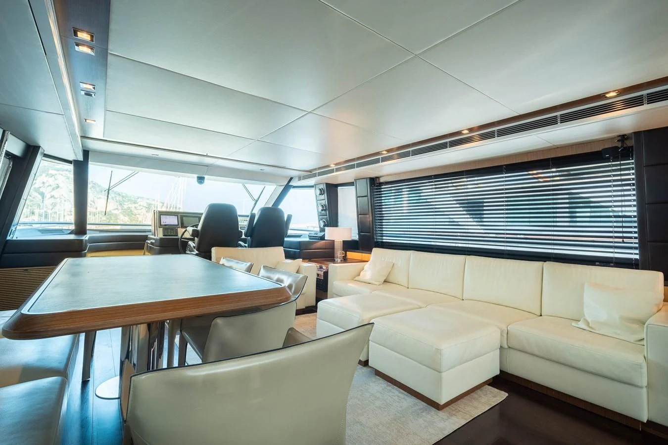 a room with a table and chairs aboard CHARISMA II Yacht for Sale
