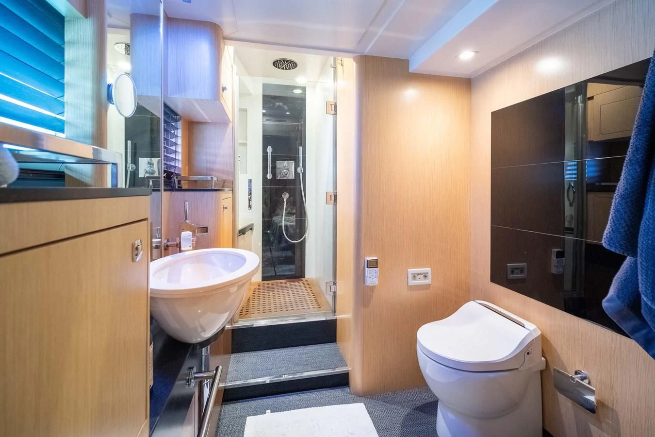 a bathroom with a sink toilet and a bathtub aboard CHARISMA II Yacht for Sale