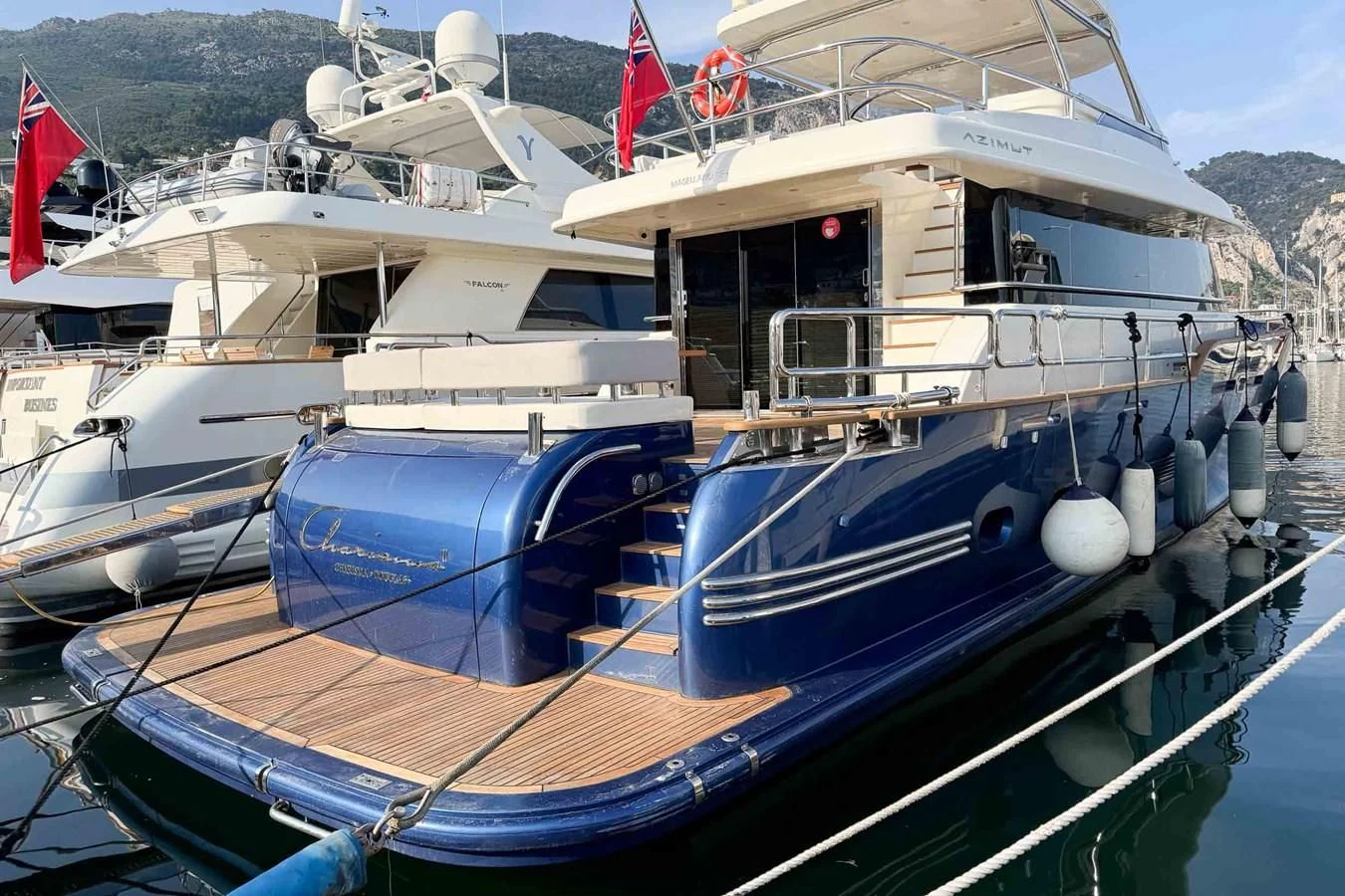a couple of boats are parked in a harbor aboard CHARISMA II Yacht for Sale