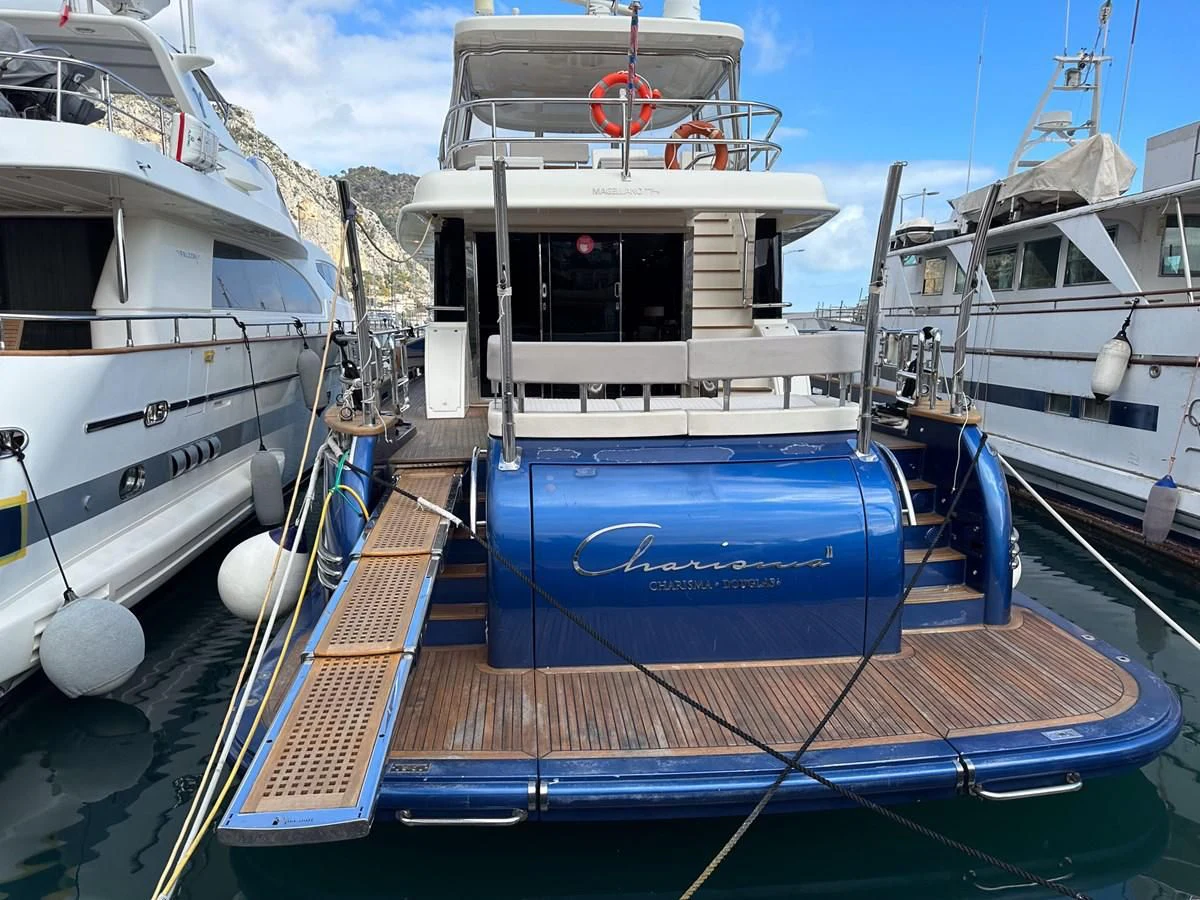 a boat tied to a dock aboard CHARISMA II Yacht for Sale
