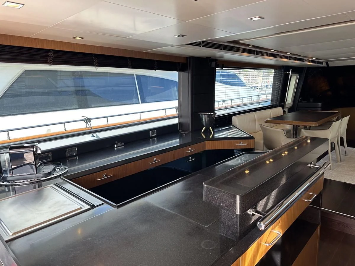 a large kitchen with a large window aboard CHARISMA II Yacht for Sale