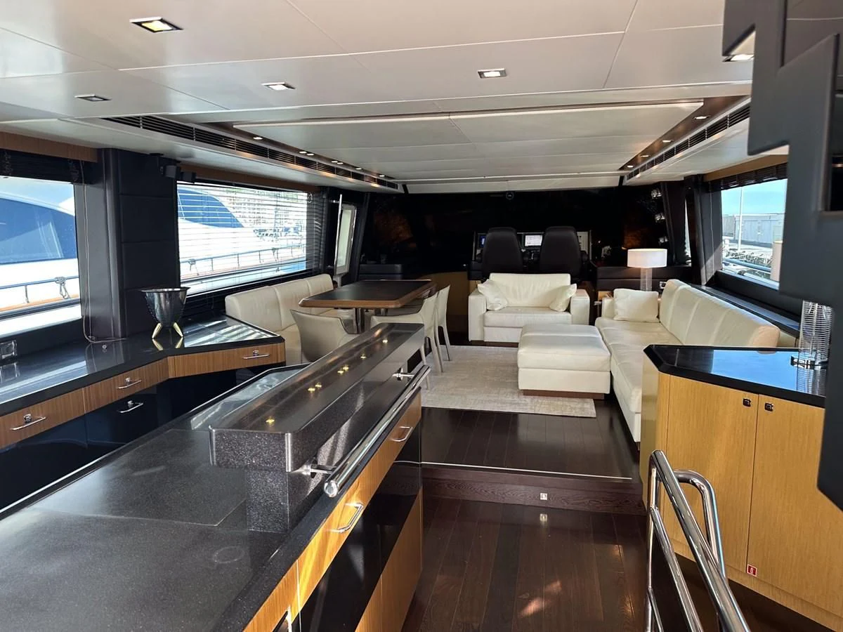 a large kitchen with a bar and bar aboard CHARISMA II Yacht for Sale