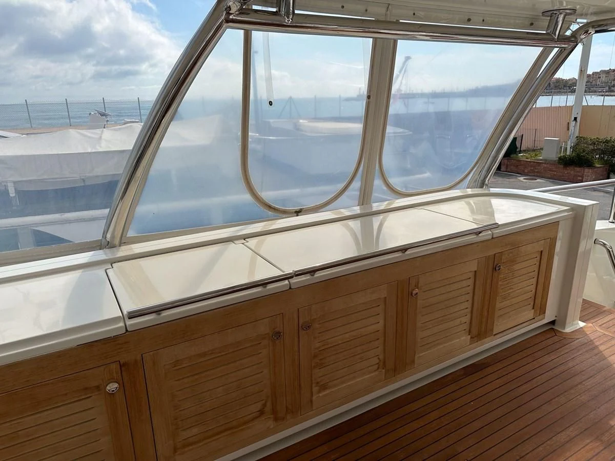 a wood deck overlooking a body of water aboard CHARISMA II Yacht for Sale