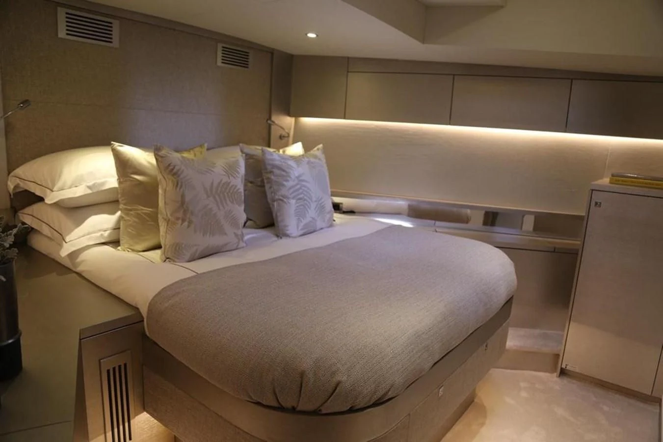 a bed with white sheets aboard ALILEA Yacht for Sale