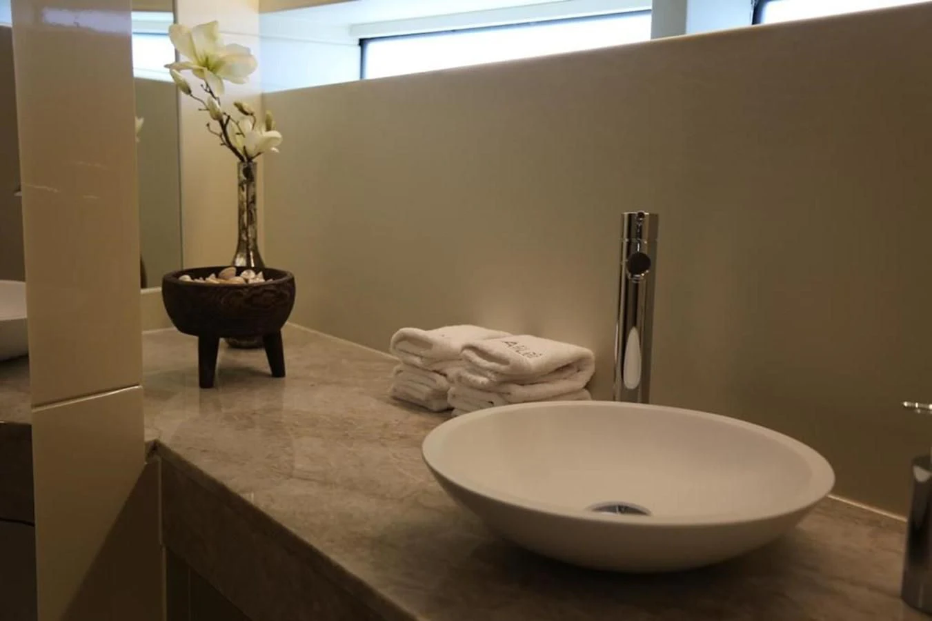 a bathroom with a sink and a mirror aboard ALILEA Yacht for Sale