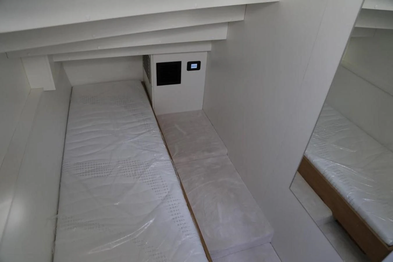 a white room with a white wall aboard ALILEA Yacht for Sale