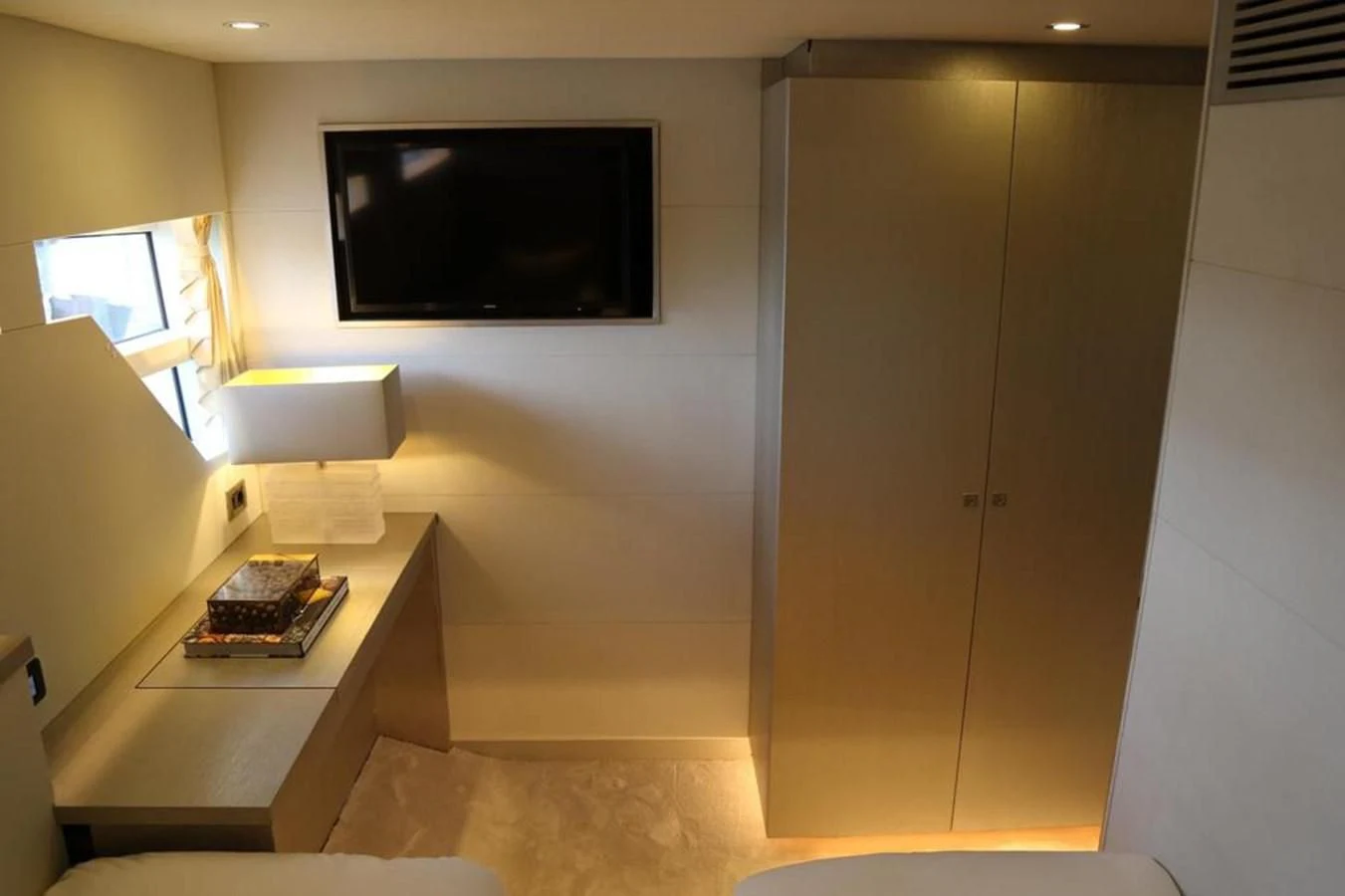 a room with a tv and a desk aboard ALILEA Yacht for Sale