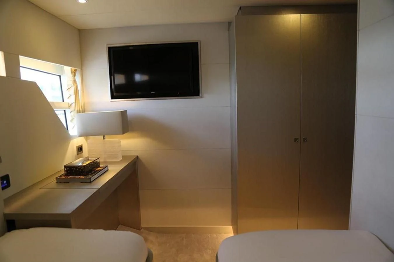 a room with a tv and a bed aboard ALILEA Yacht for Sale