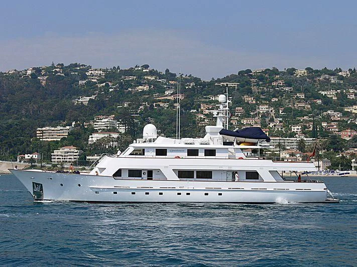 a large white boat in the water aboard COMMITMENT Yacht for Sale