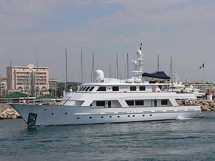a white yacht in the water aboard COMMITMENT Yacht for Sale