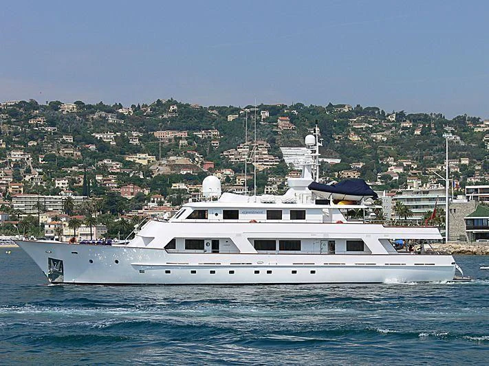 a large white boat in the water aboard COMMITMENT Yacht for Sale