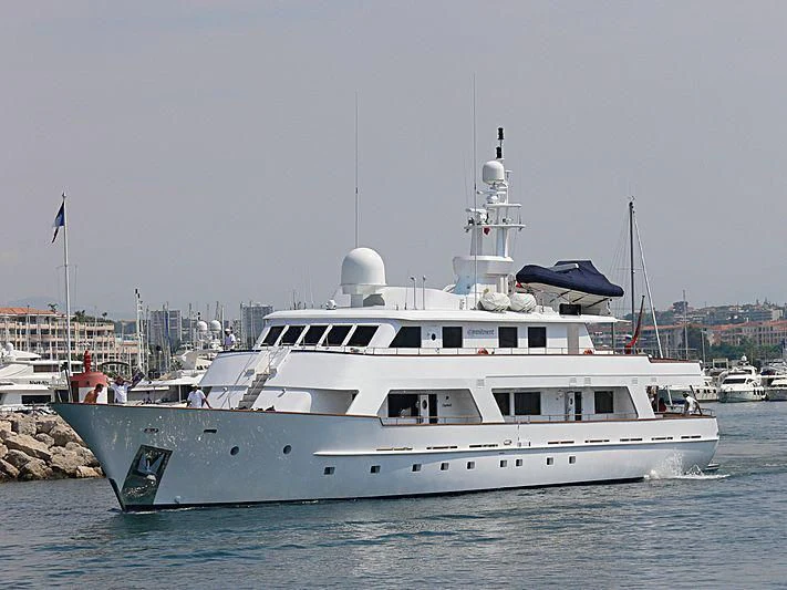 a large white boat in the water aboard COMMITMENT Yacht for Sale