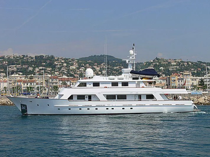 a white boat in the water aboard COMMITMENT Yacht for Sale