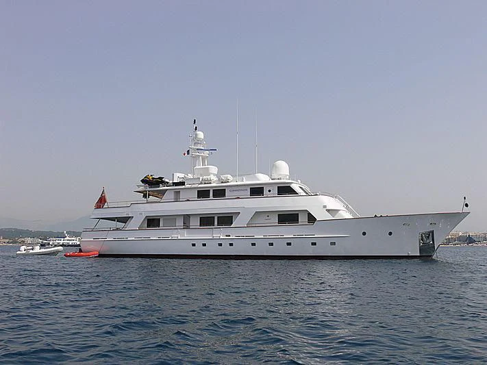 a large white boat in the water aboard COMMITMENT Yacht for Sale