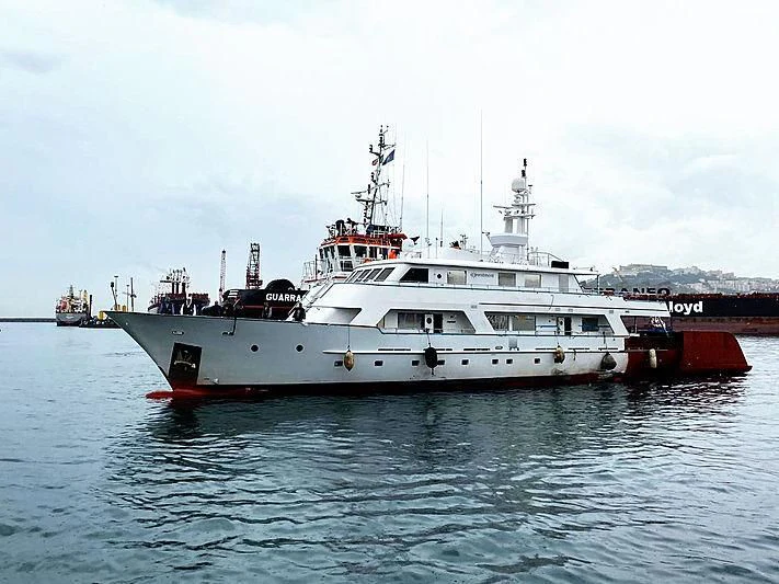 a large white boat in the water aboard COMMITMENT Yacht for Sale