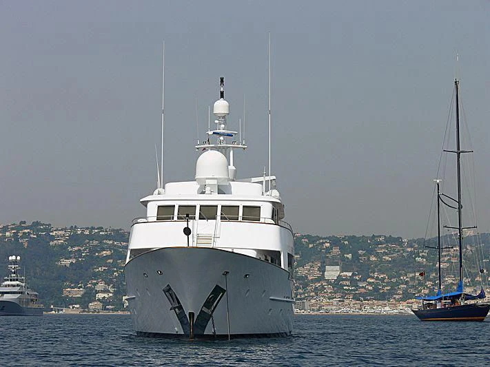 a large white boat in the water aboard COMMITMENT Yacht for Sale