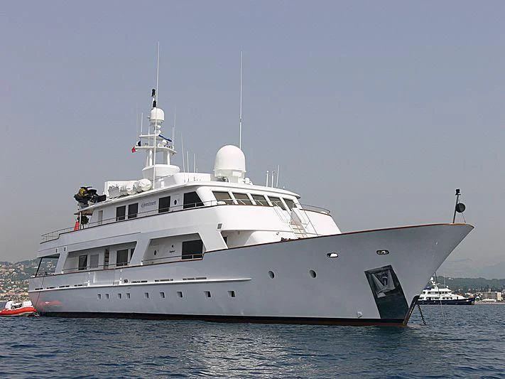 a large white boat in the water aboard COMMITMENT Yacht for Sale