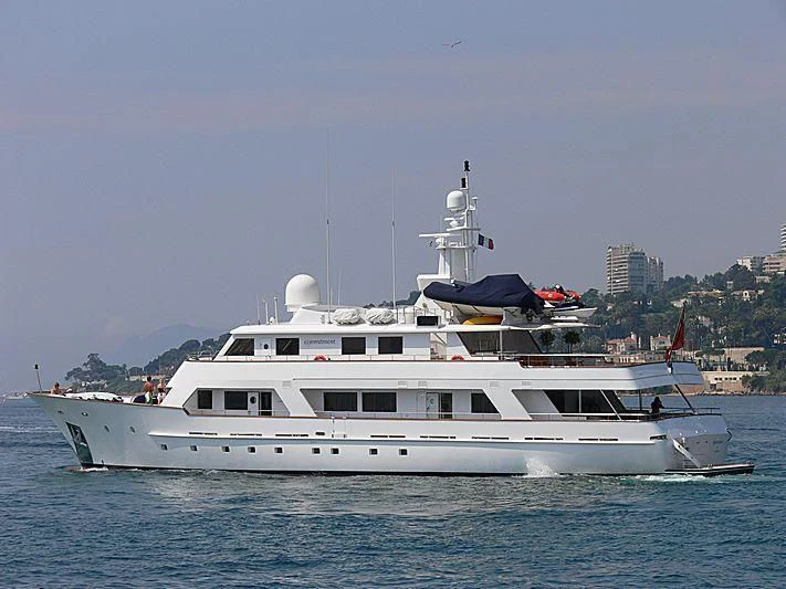 a large white boat in the water aboard COMMITMENT Yacht for Sale