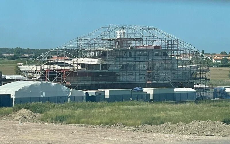 a large stadium with a field in front of it aboard COMMITMENT Yacht for Sale