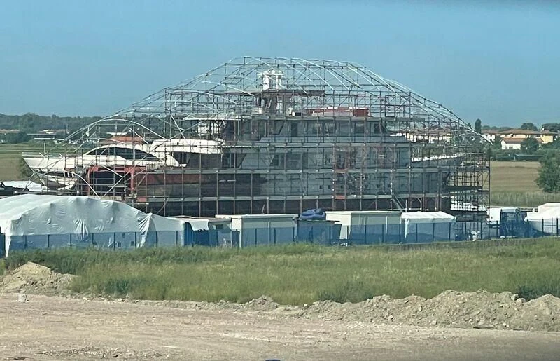 a stadium with a field in front of it aboard COMMITMENT Yacht for Sale