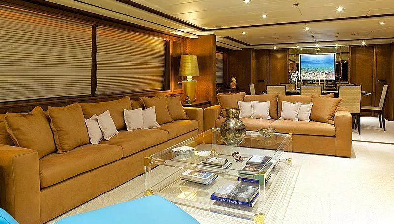 a living room with a couch and coffee table aboard IDYLLE Yacht for Sale